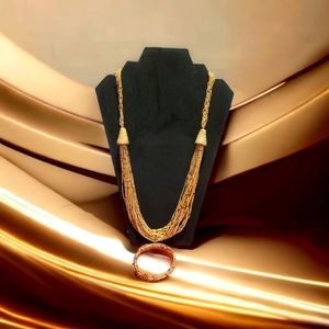 A  necklace with a matching bracelet , brown in color.